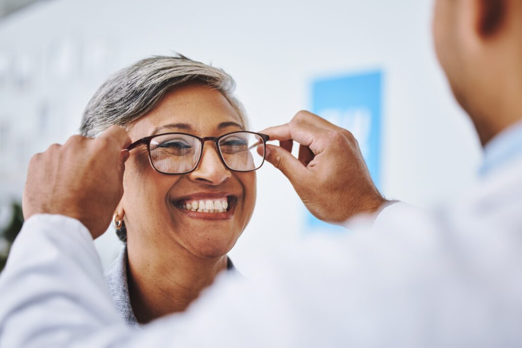 Optometry,,Smile,And,Woman,With,Prescription,Glasses,,Optician,And,Helping