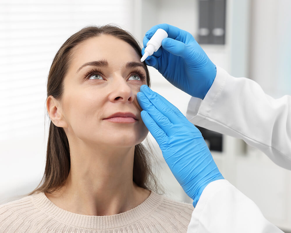 Woman getting eye drops for dry eye